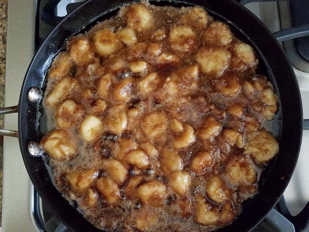 caramelizing bananas, brown sugar, and coconut oil in skillet