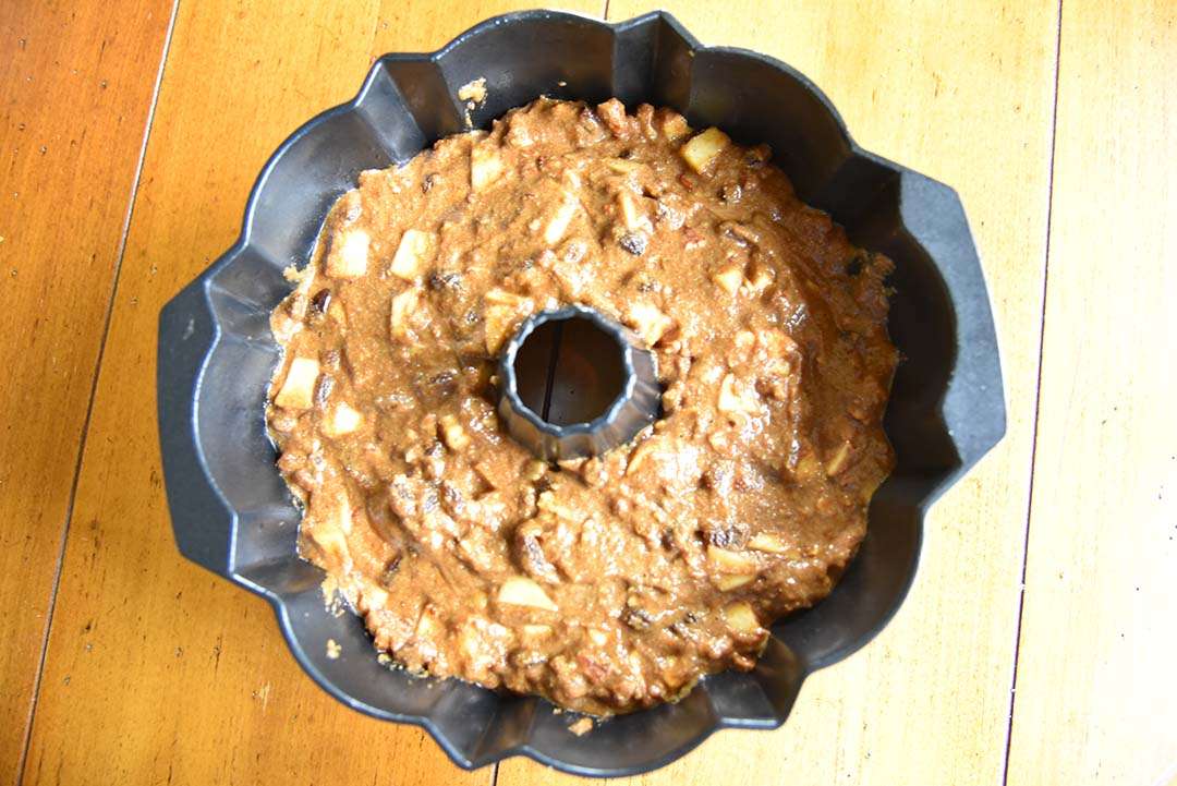 apple cake batter in Bundt pan