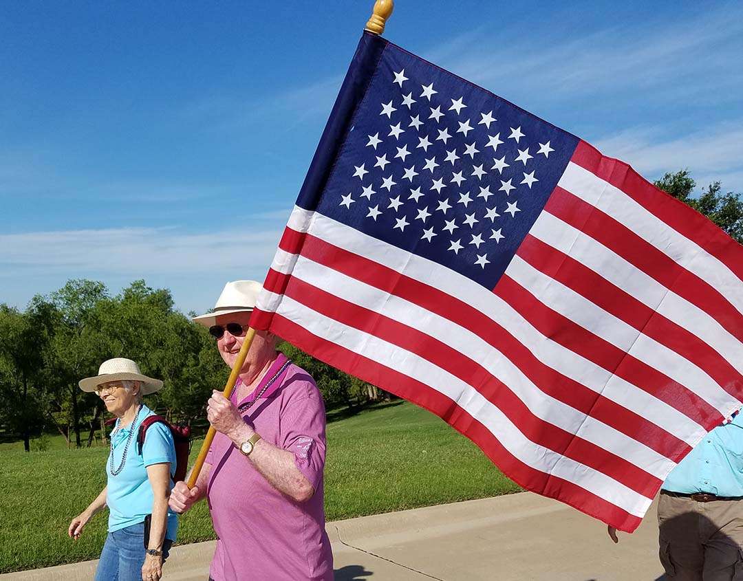 Happy 4th of July - carrying American flag in parade